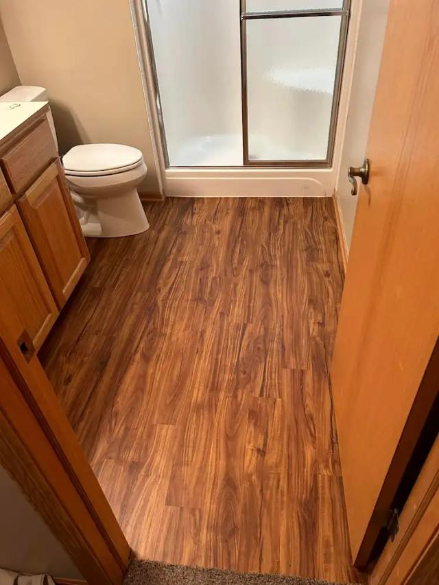 home bathroom with new luxury vinyl flooring