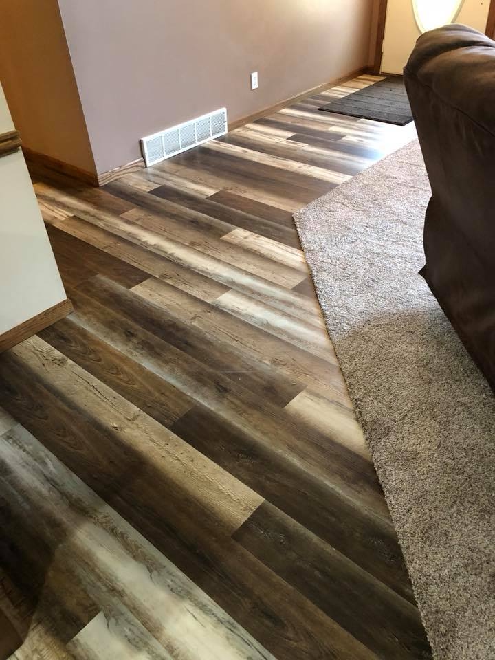 living room with luxury vinyl planks and carpet