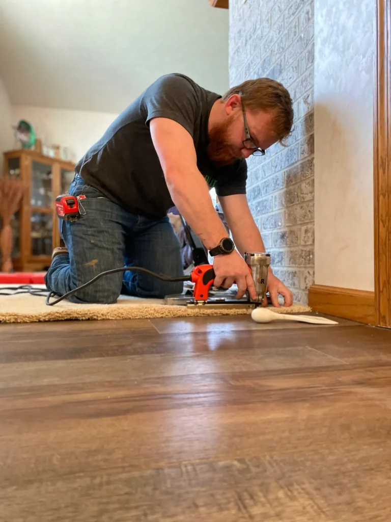 installer finishing the carpet edge