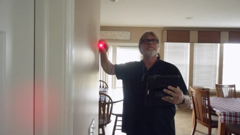 Shon measuring customers home with a laser